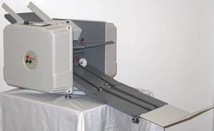A machine displayed on a table with a clean white backdrop.