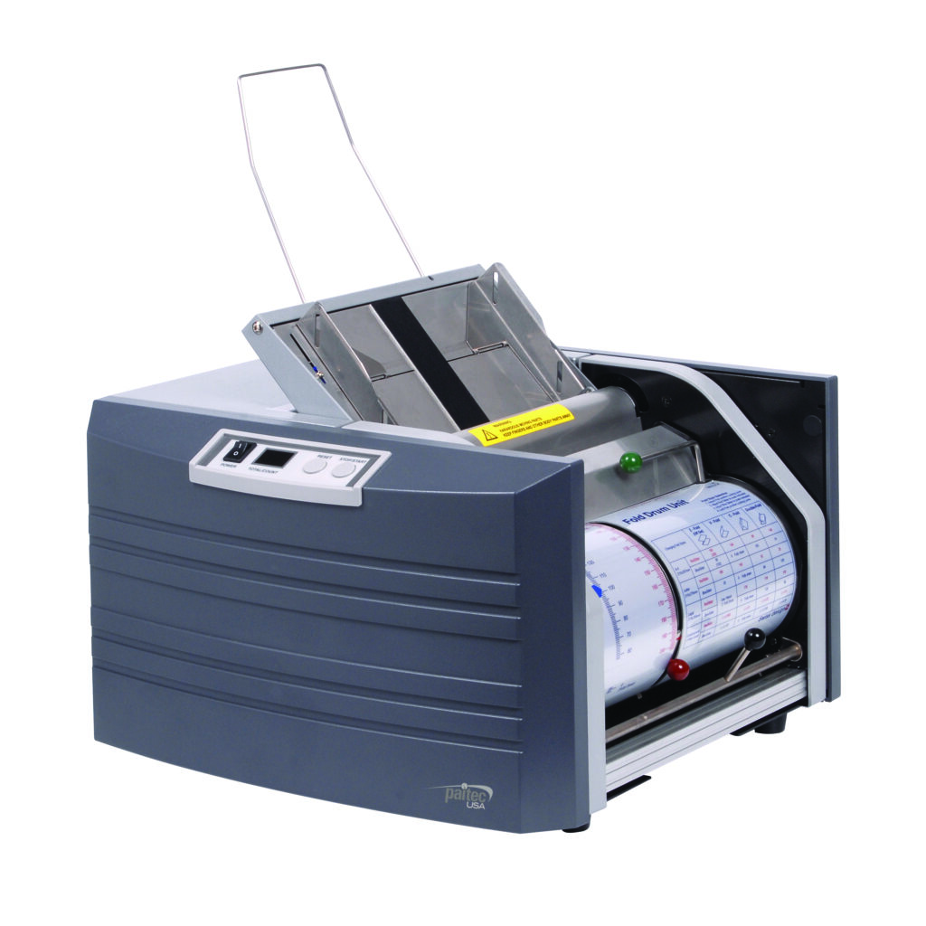 A machine featuring a roll of paper on top, typically used for printing or document production.