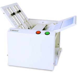 A white machine featuring a paper cutter on top, designed for cutting paper efficiently.